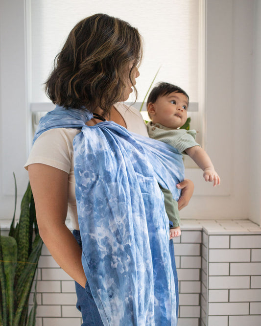 mom carrying a baby hand dyed linen ring ring