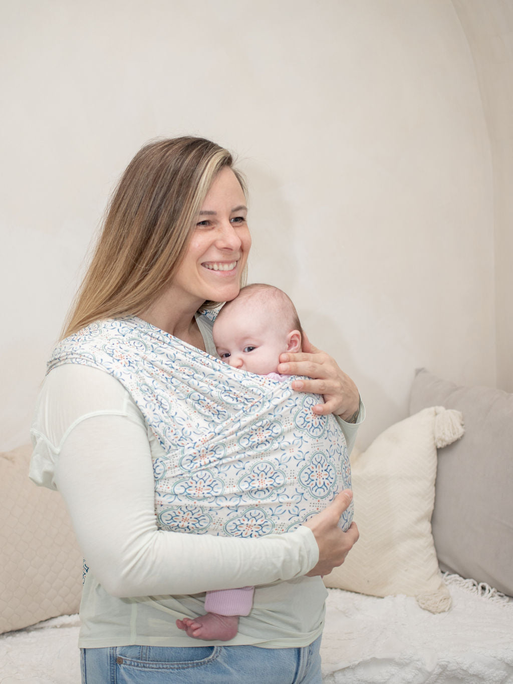 Mom wearing baby in Mediterranean Tile Printed Stretch Wrap Baby Carrier