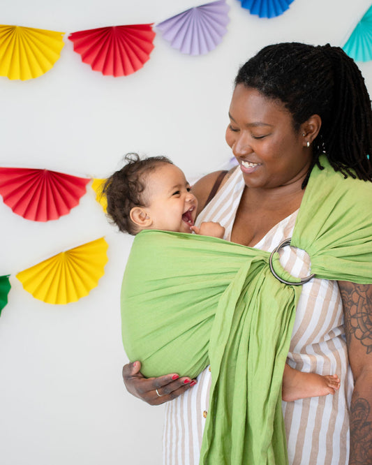 Baby Laughing in Green Linen Ring Sling Carrier